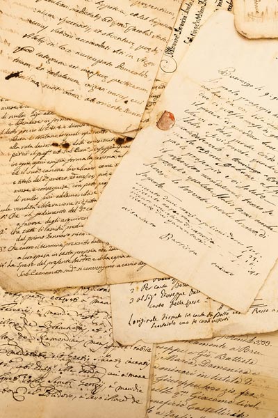 Scattered papers with handwritten calligraphy text